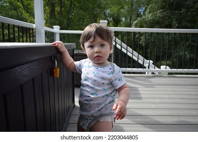 Hairy Baby Hanging Out On The Deck During Summer Time