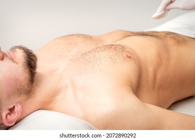 Hairy Body, Stomach, And Chest Of A Man Lying Before Epilation