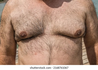 Hairy Chest Older Man On The Beach