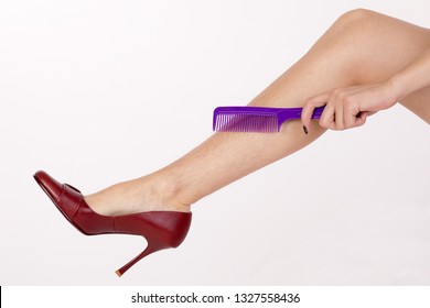 Hairy Legs Of A Woman In Red Shoes