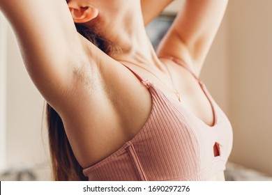 Hairy unshaven female armpits. Body positive trend. Woman wearing bra raised arms. Acceptance of body naturalness self love. Hair removal - Shutterstock ID 1690297276