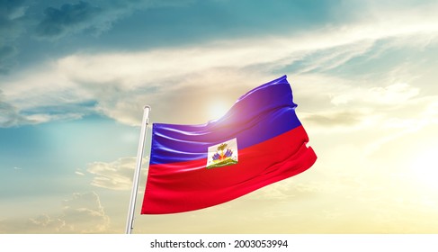 Haiti national flag waving in beautiful clouds.