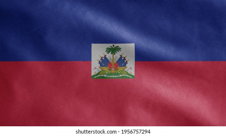 Haitian Flag Waving In The Wind. Close Up Of Haiti Banner Blowing, Soft And Smooth Silk. Cloth Fabric Texture Ensign Background. Use It For National Day And Country Occasions Concept.