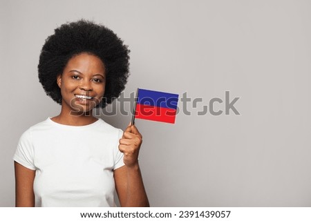 Haitian woman holding flag of Haiti Education, business, citizenship and patriotism concept