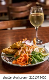 Hake Filet With Lemon White Wine Salad On Wood