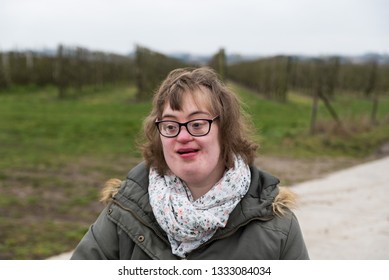 Hakendover, Flanders  Belgium - 03 02 2019: Portrait of a happy white woman with Down Syndrome and myopia 