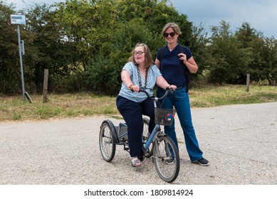 Hakendover, Flanders   Belgium - 07 25 2020: Portrait of a cute 38 year old girl with Down Syndrome and her friend