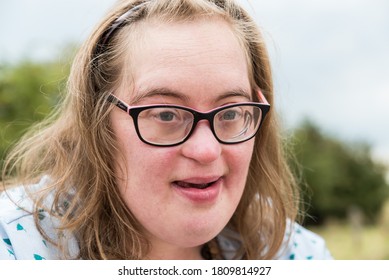 Hakendover, Flanders   Belgium - 07 25 2020 Portrait Of A Cute 38 Year Old Girl With Down Syndrome