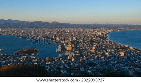Hakodate, Japan - Apr 27, 2023. Landscape of the port city at sunset, seen from the top of Mount Hakodate, Japan.
