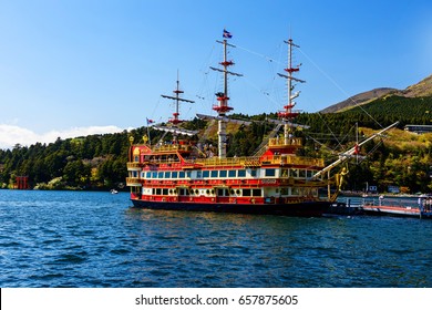 HAKONE, JAPAN - MAY 5, 2017: Red Pirate Ship At Dock And Torii Gate Hakone Shrine At Ashi Lake. Pirate Tourist Ship Is One Of The Most Famous Hakone Signs.