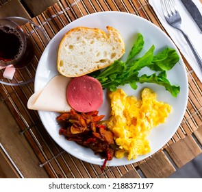 Halal Breakfast At The Hotel Of A Delicious Omelet, Smoked Sausage, Cheese, Lecho, Herbs And Bread With Tea.