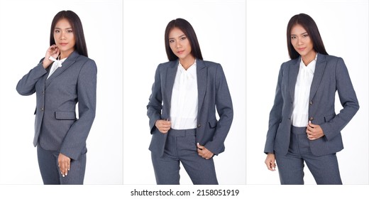 Half Body Portrait Of 20s Asian Business Woman Black Short Hair White Shirt Gray Suit Pant. Female Express Feeling Smart Smile Over White Background Isolated