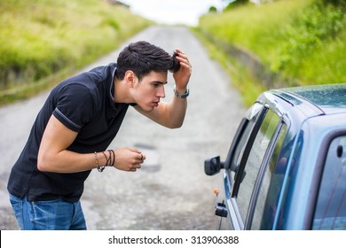 Half Body Shot Of A Handsome Young Man Looking At His Reflection On A Car Window And Fixing His Hair.