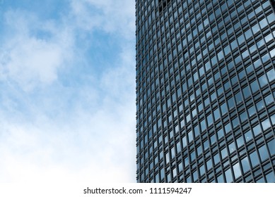 Half building and cloudy sky background