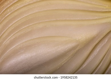 Half A Bulb Onion. Gold Onion Vegetable. Raw Hide Close Up.