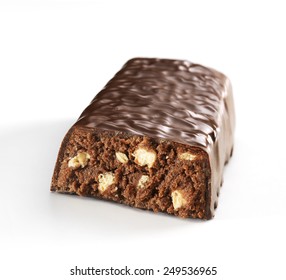 Half Cereal Bar Of Dark Chocolate Isolated On A White Background