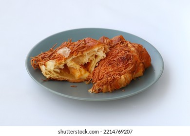 Half Cut Of Cheese Croissant Served On Plate Isolated On White Background