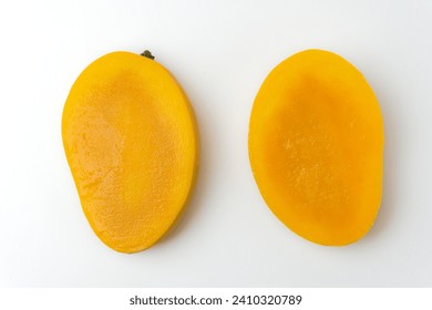 half cut juicy ripe mango isolated on white background, top view - Powered by Shutterstock