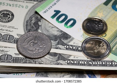 Half Dollar Coin And One And Two Euro Coin On Top Of One Hundred, 100, Euro And Dollar Banknotes. Different Currencies. Stack Of Money For Financial Hardship Relief