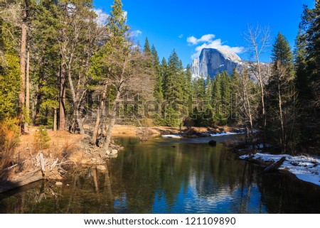 Half Dome reflected in the Merced River in Yosemite Valley, California.