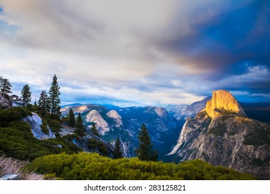 Half Dome Rock Yosemite National Park at Sunset.  Forest in foreground. - Powered by Shutterstock