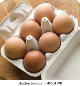 Half A Dozen Eggs In Cardboard Carton