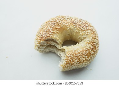 Half Eaten Bagel On White Background 