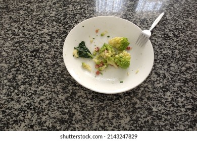 A Half Eaten Plate Of Pasta