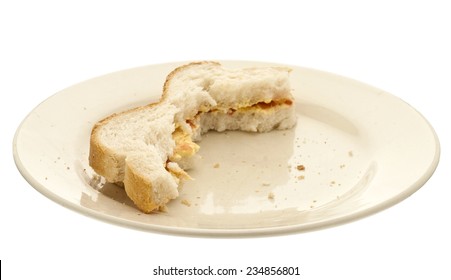 Half Eaten Sandwich On A Plate