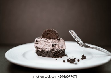 A half eaten slice of a cookies and cream cheesecake - Powered by Shutterstock