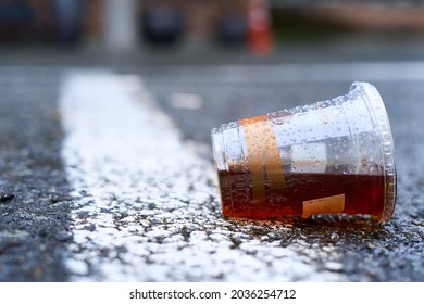 Half Empty Coffee Cup On The Street                            