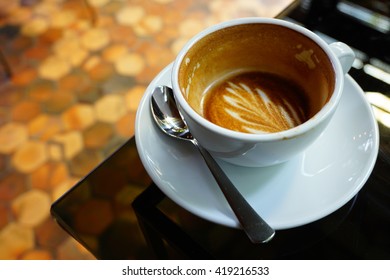 Half Empty Coffee In White Cup On Table