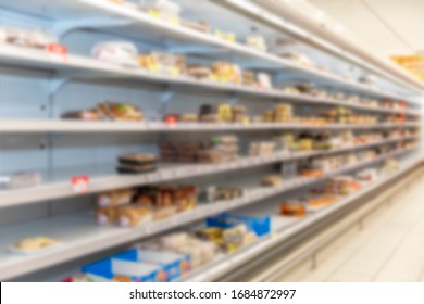 Half Empty Shelves In A Supermarket. Blurred. Meat Semi-finished Products. Side View.