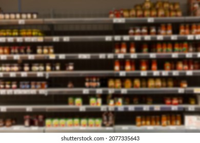 Half Empty Store Shelves. Hunger, Financial And Food Crisis. Blurred.