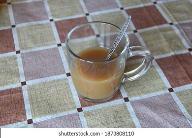 Half Empty Transparent Cup Of Coffee