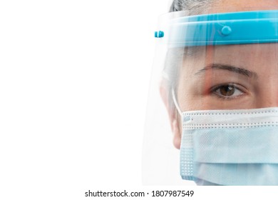 Half Face Close-up Of Adult Woman Model Wearing Transparent Shield And Surgical Or Medical Disposable Mask Covering Nose Mouth As Covid19 Coronavirus Pandemic Protection With Copyspace