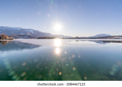 Half frozen Faakersee on a winters day, Villach, Carinthia, Austria