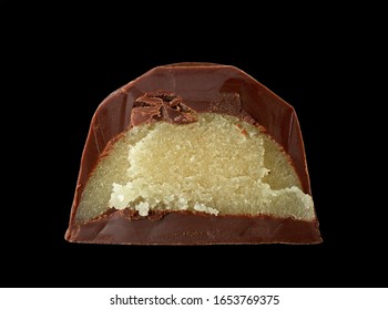 Half Of Homemade Chocolate Praline Macro Isolated On Black Background