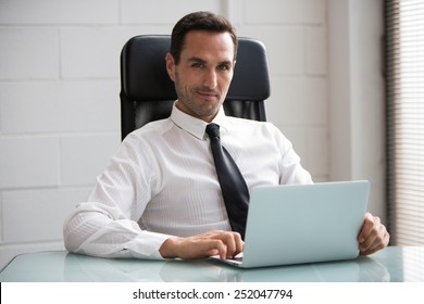 Half Length Portrait Of A Male Businessman In The Office