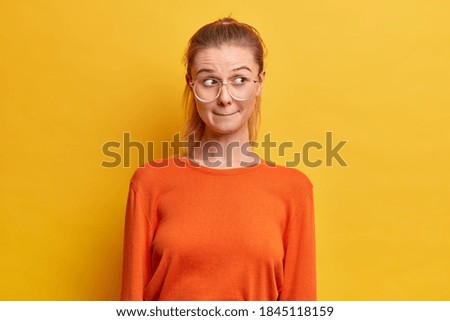 Image, Stock Photo skeptical woman in half light
