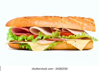 Half Of Long Baguette Sandwich With Lettuce, Tomatoes, Ham, Turkey Breast And Cheese