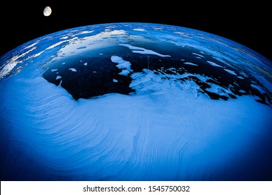 Half Moon Above A Frozen Lake, Fish Eye View.