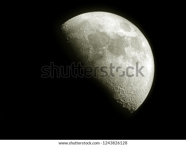 Half\
moon / The Moon is an astronomical body that orbits planet Earth\
and is Earth\'s only permanent natural satellite. It is the\
fifth-largest natural satellite in the Solar\
System