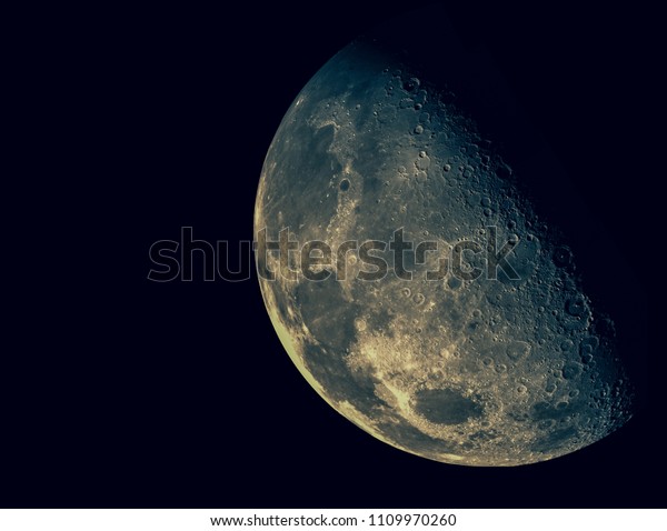 Half Moon\
Background / The Moon is an astronomical body that orbits planet\
Earth, being Earth\'s only permanent natural satellite / Vintage\
concept / this image furnished by NASA\
