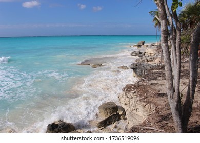 Half Moon Bay In Turks And Caicos On A Sunny Day With Trees Near The Beach And The Blue Ocean And Waves Breaking. 