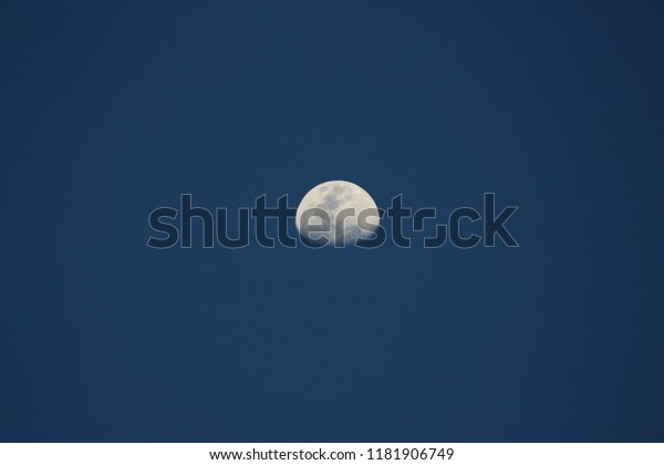 half moon with blue\
sky