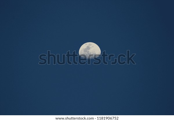 half moon with blue\
sky