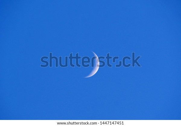 half moon at blue\
sky