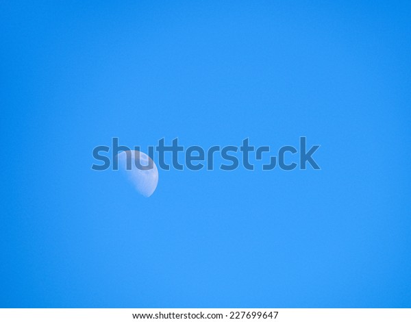 half moon in the blue sky\
