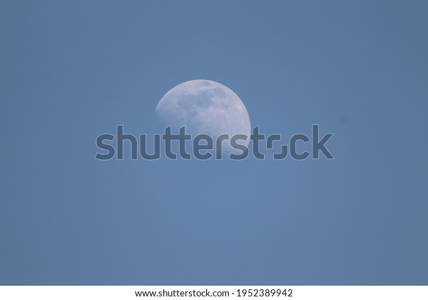 Half Moon in blue sky The Moon is an
astronomical body that orbits planet Earth, being Earth's only
permanent natural
satellite